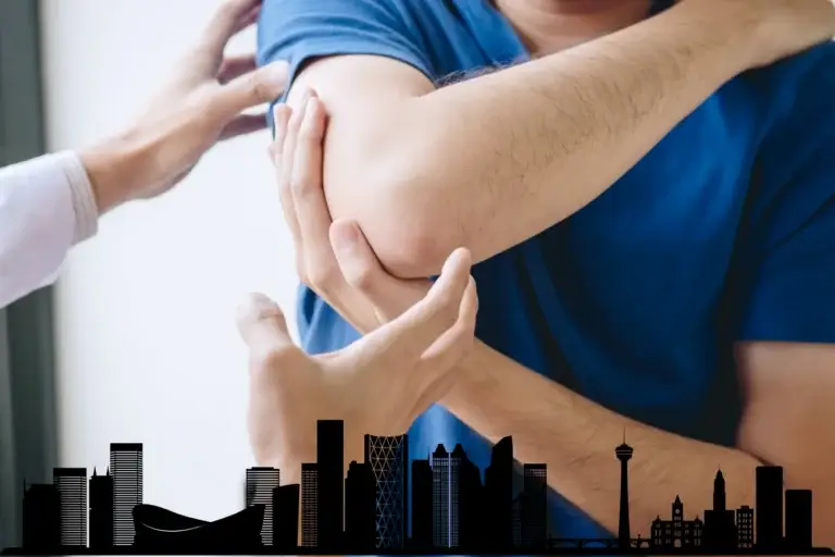 A Calgary chiropractor working on a patients elbow injury