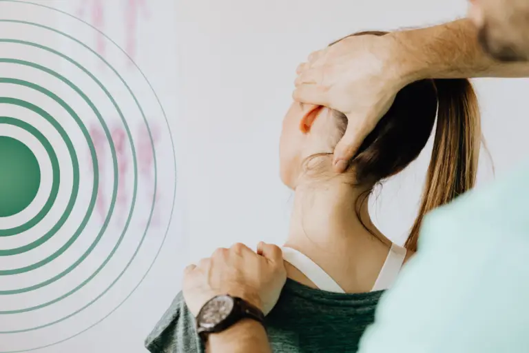A practitioner performing physio for chronic pain in a patients neck